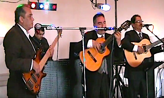 Trio America's musicians are very personable and professional Trio America on stage performing at an anniversary party.